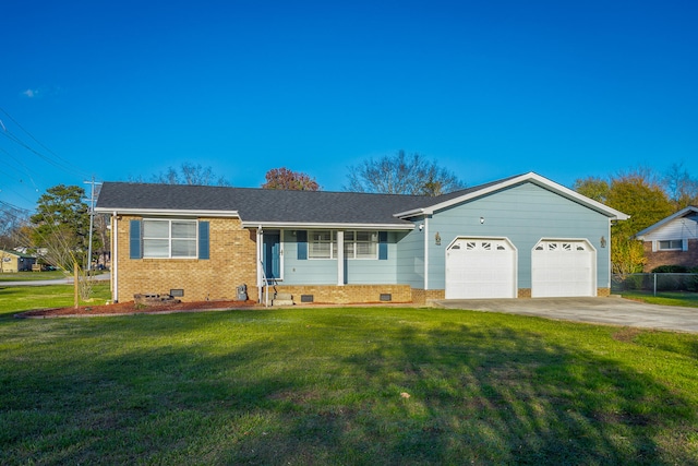 ranch-style house with a garage and a front lawn