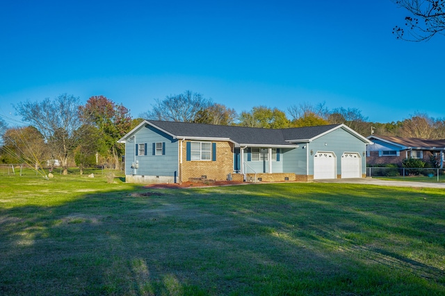 ranch-style house featuring a garage and a front lawn