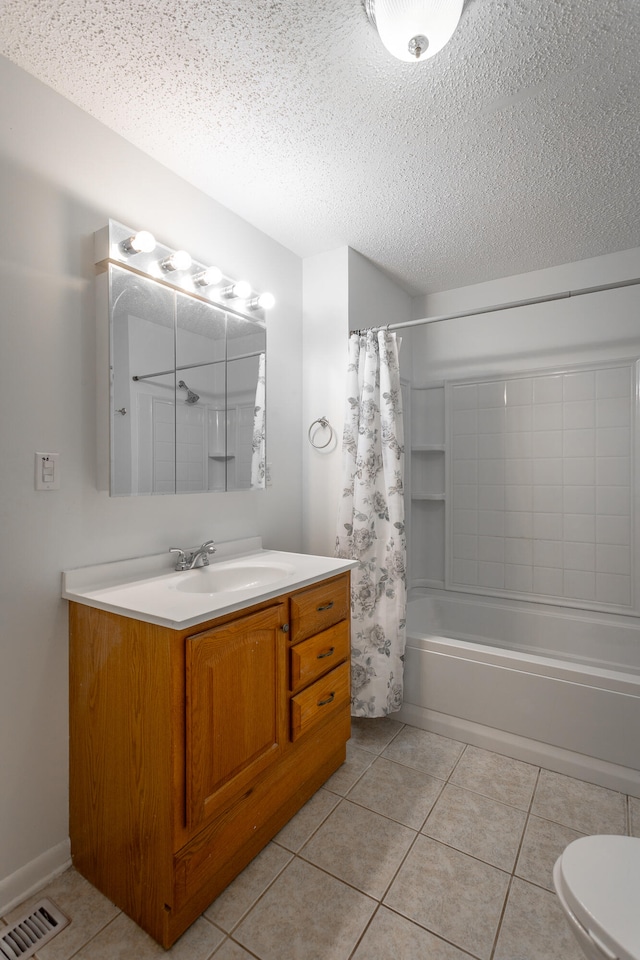 full bathroom with tile patterned floors, a textured ceiling, toilet, vanity, and shower / tub combo