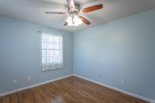 unfurnished room featuring ceiling fan, wood-type flooring, and a textured ceiling