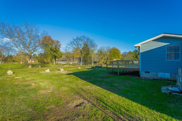 view of yard with a wooden deck