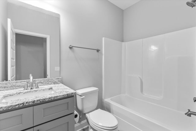 full bathroom featuring bathtub / shower combination, vanity, and toilet