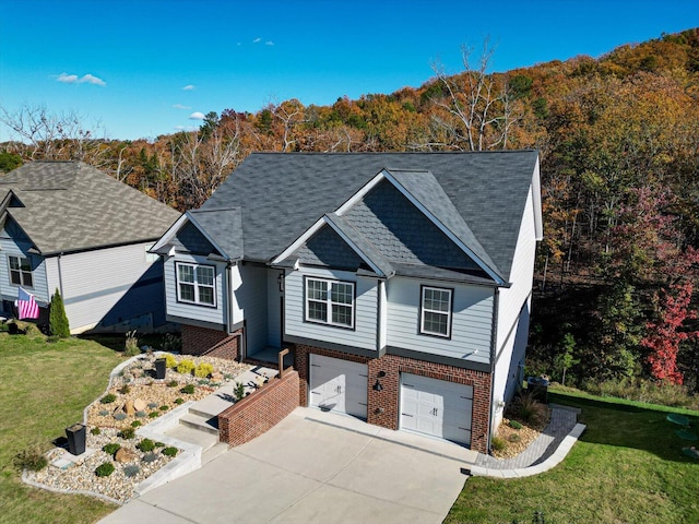 view of front of home featuring a front yard and a garage