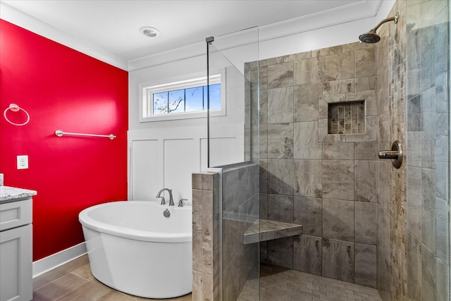 bathroom with hardwood / wood-style floors, vanity, independent shower and bath, and ornamental molding