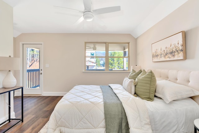 bedroom with lofted ceiling, multiple windows, dark hardwood / wood-style floors, and ceiling fan