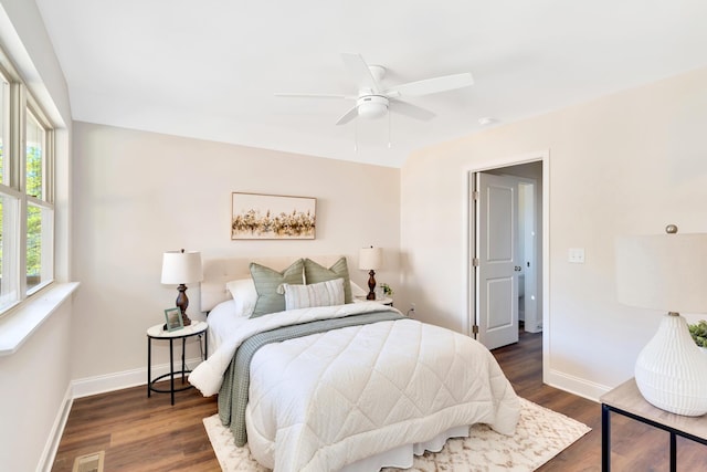 bedroom featuring dark wood-type flooring and ceiling fan