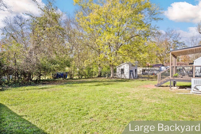 view of yard featuring a wooden deck