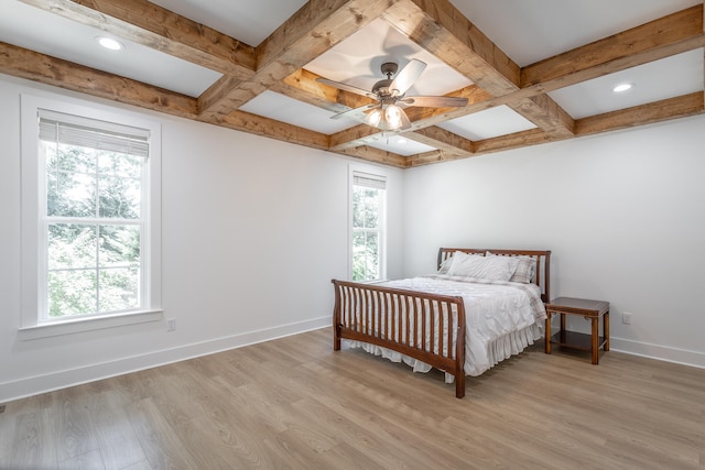 bedroom with beamed ceiling, light hardwood / wood-style flooring, ceiling fan, and coffered ceiling