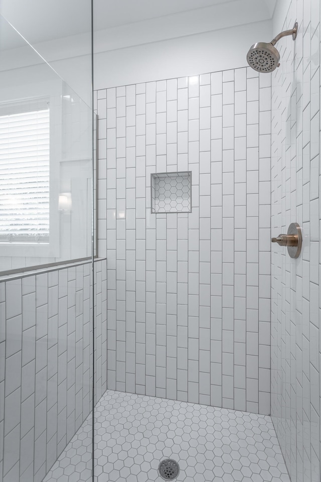 bathroom with tiled shower