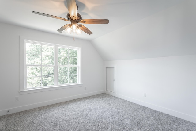 bonus room with carpet flooring, a wealth of natural light, and lofted ceiling