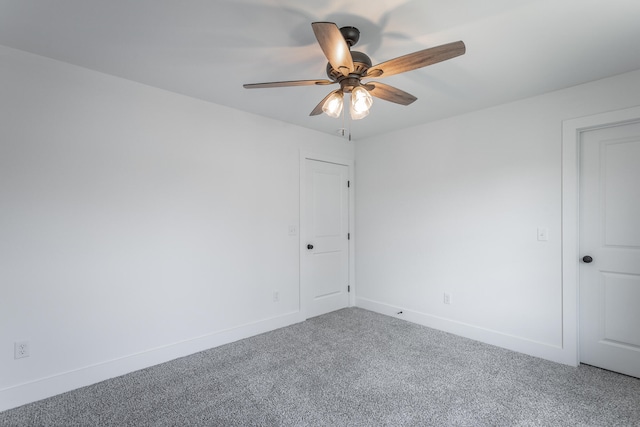 empty room with carpet flooring and ceiling fan