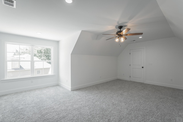 bonus room with carpet flooring, ceiling fan, and vaulted ceiling