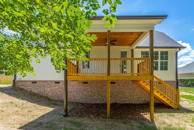 rear view of house featuring ceiling fan and a deck