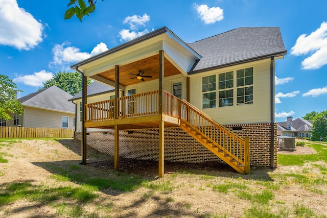 rear view of property with central air condition unit, a wooden deck, and ceiling fan