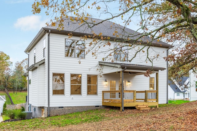 rear view of house featuring a deck and cooling unit