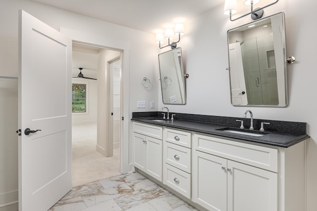 bathroom featuring vanity, ceiling fan, and walk in shower