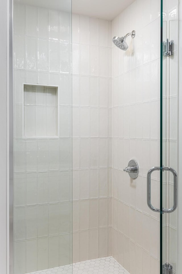 bathroom featuring an enclosed shower