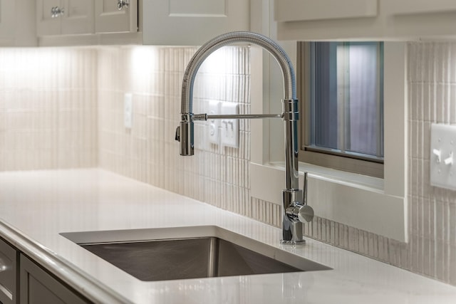 interior details with backsplash and sink