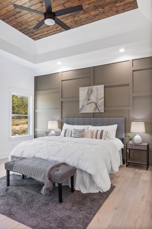 bedroom featuring wood ceiling, ceiling fan, and light hardwood / wood-style floors