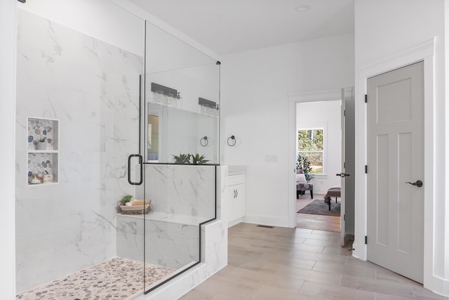 bathroom featuring vanity and walk in shower