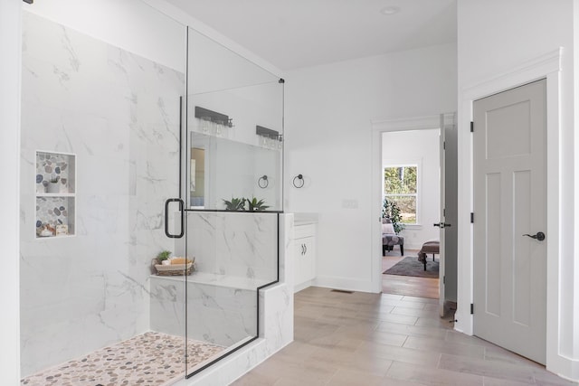 8340 Snowdrop Way, Ooltewah, TN 37363 - bathroom featuring a marble finish shower, baseboards, connected bathroom, and vanity