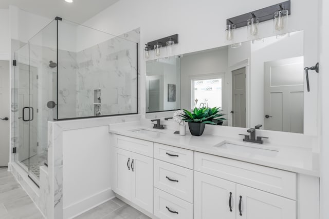 bathroom with vanity and an enclosed shower