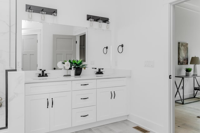 bathroom featuring hardwood / wood-style floors and vanity