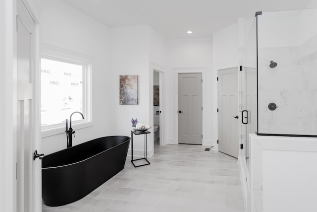 8340 Snowdrop Way, Ooltewah, TN 37363 - bathroom with a marble finish shower, a freestanding bath, and recessed lighting