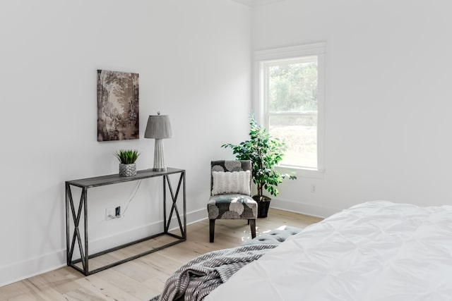 bedroom featuring light hardwood / wood-style floors and multiple windows