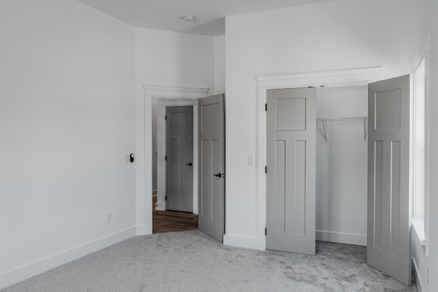 8340 Snowdrop Way, Ooltewah, TN 37363 - unfurnished bedroom featuring carpet flooring, baseboards, and a closet