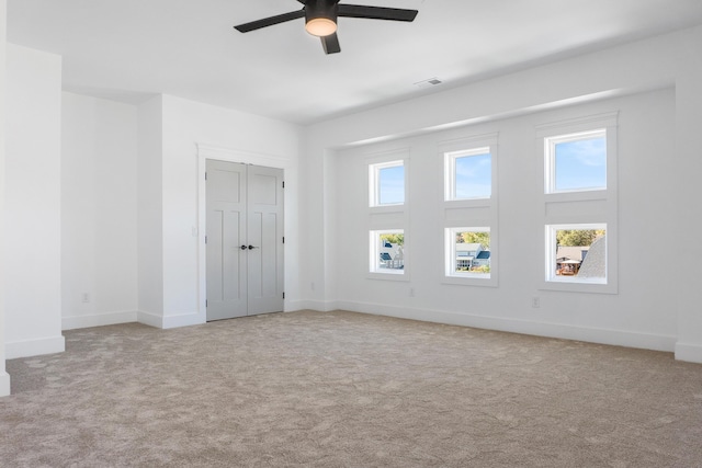 8340 Snowdrop Way, Ooltewah, TN 37363 - unfurnished bedroom with carpet flooring, baseboards, a ceiling fan, and a closet
