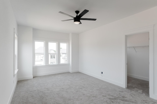 8340 Snowdrop Way, Ooltewah, TN 37363 - unfurnished bedroom featuring carpet, a spacious closet, baseboards, a closet, and ceiling fan