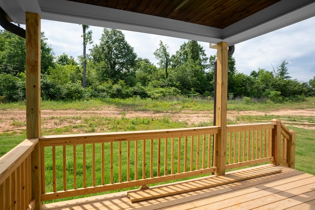 deck featuring a lawn