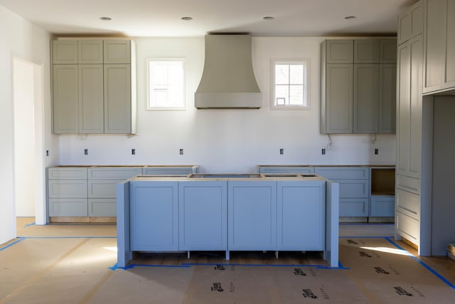 kitchen featuring wall chimney exhaust hood