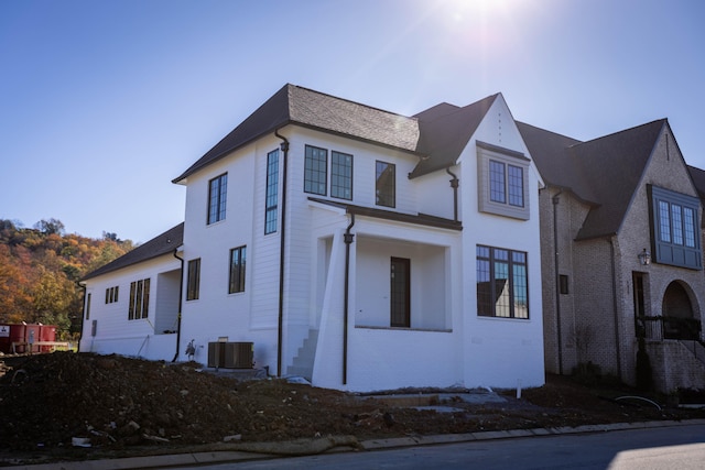 view of side of home with cooling unit