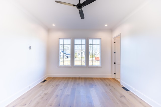 spare room featuring light wood-style floors, recessed lighting, visible vents, and baseboards