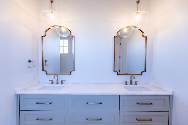 bathroom featuring double vanity and a sink