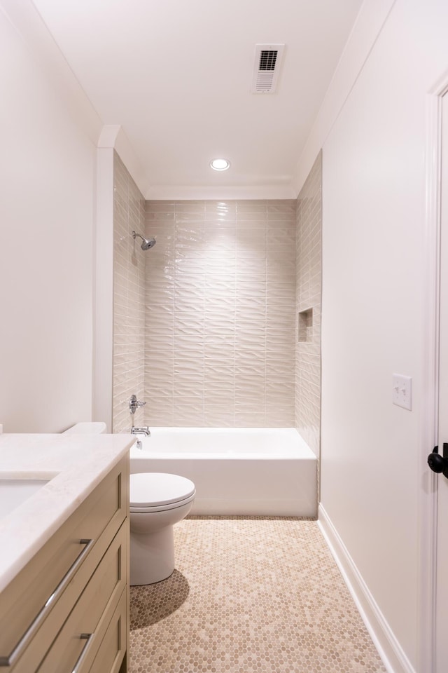 bathroom with baseboards, visible vents, toilet, tub / shower combination, and vanity