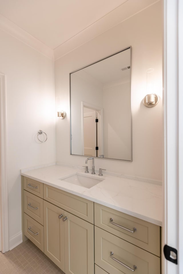 bathroom featuring visible vents, crown molding, and vanity