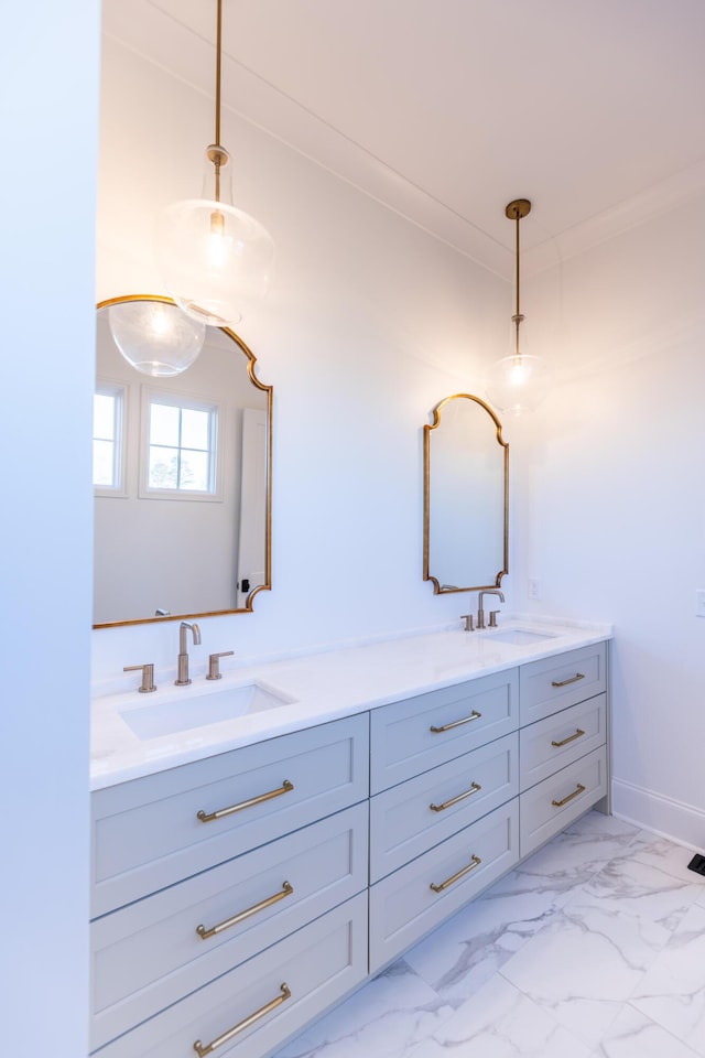 full bathroom featuring double vanity, marble finish floor, and a sink