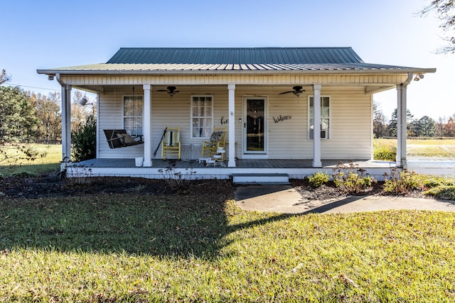 view of front of house with covered porch and a front yard