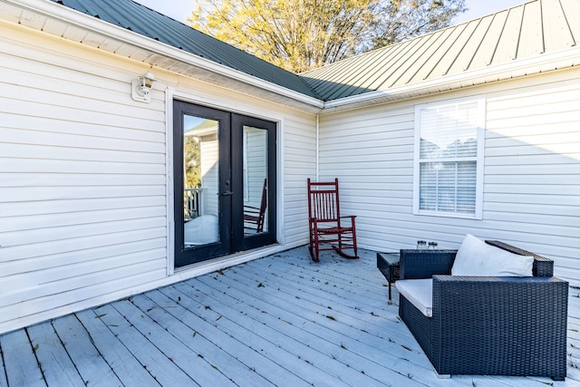 wooden terrace featuring french doors