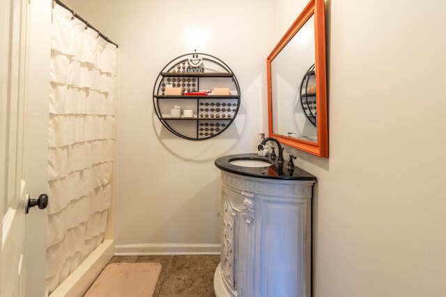 bathroom with tile patterned flooring, vanity, and a shower with shower curtain