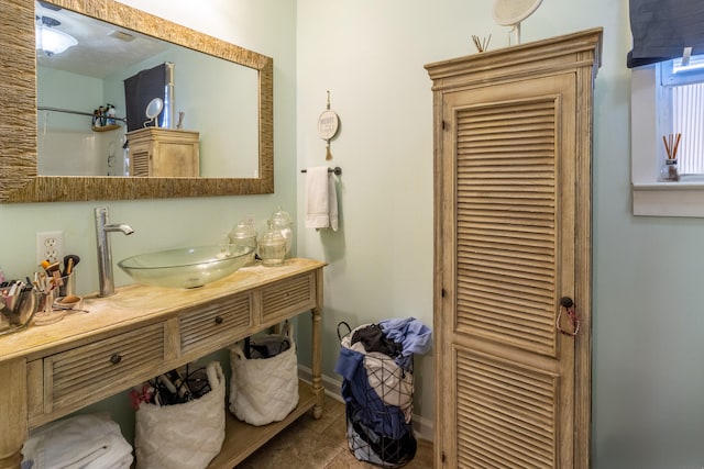 bathroom featuring tile patterned floors and vanity