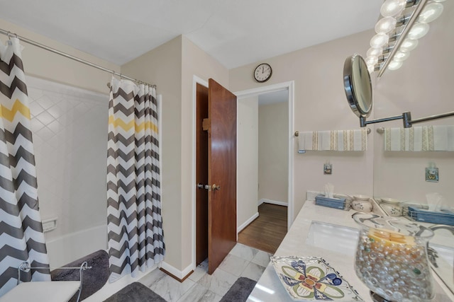 bathroom with shower / bathtub combination with curtain, hardwood / wood-style floors, and vanity