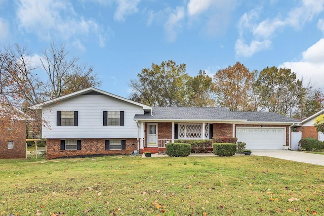 tri-level home featuring a garage and a front lawn