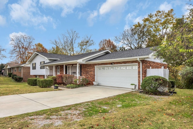 view of front of home featuring a front lawn and a garage