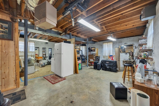 basement with white refrigerator