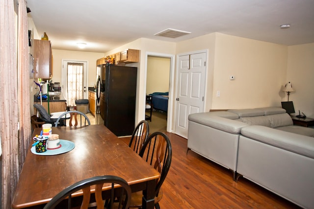 dining area featuring dark hardwood / wood-style floors