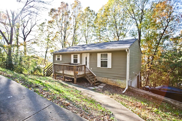 view of front facade featuring a deck and a garage